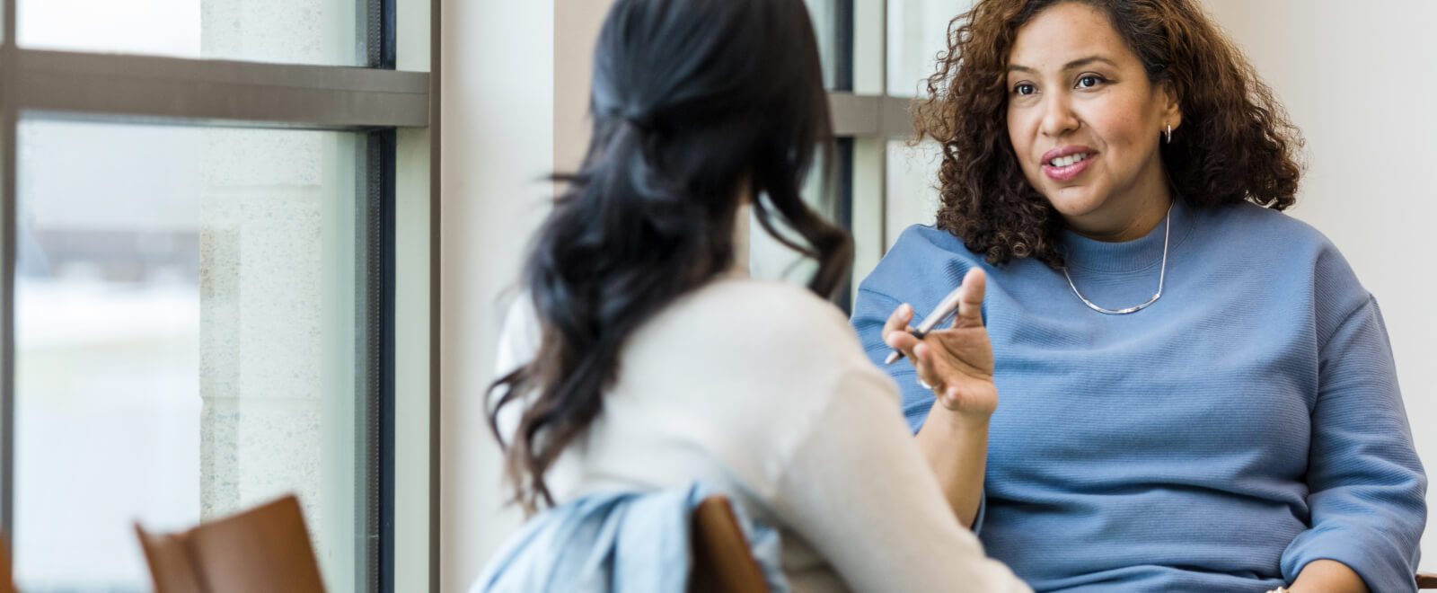 Two women in discussion