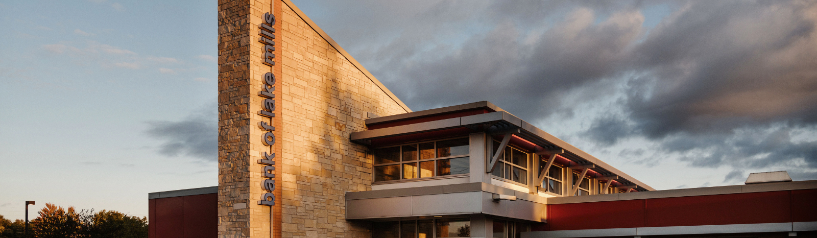 Bank of Lake Mills branch exterior at sunset